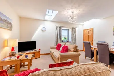a living room with a couch and a tv at 3 Bed in Isel oc-o32074 in Sunderland