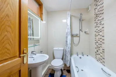 a bathroom with a toilet and a tub and a sink at 2 Bed in Isel oc-s32076 in Sunderland