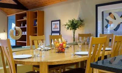 a wooden table with chairs and a dining room at Grisedale in Applethwaite