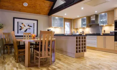 a kitchen and dining room with a table and chairs at Grisedale in Applethwaite