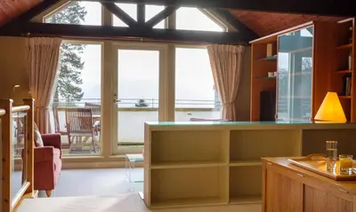 a kitchen with a large window and a table at Underscar - High Spy in Applethwaite