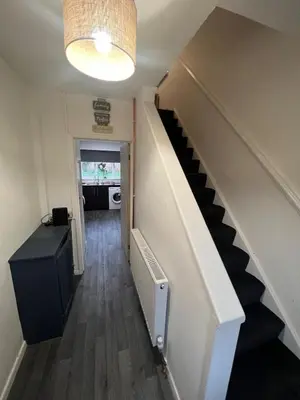 a hallway with a staircase in a house at Beautiful modern self-contained house in Moffat