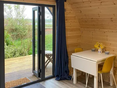 a room with a white table and a window at The Eden Hideaway - Uk1554 in Rockcliffe