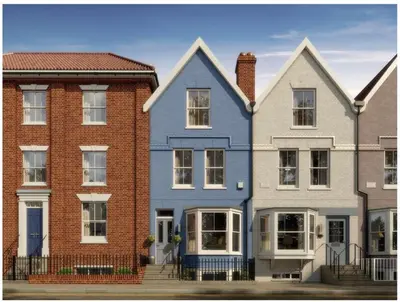 a group of houses in a row with a blue house at The Beach House in Moffat