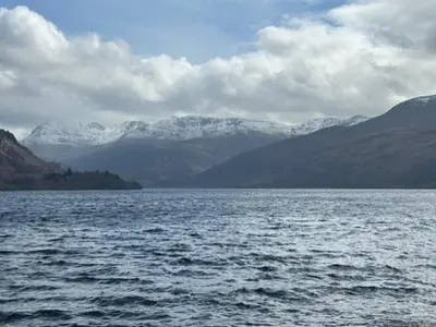 a large body of water with snow covered mountains at 51 Brisco Mount 3 bedroom house in Woodend