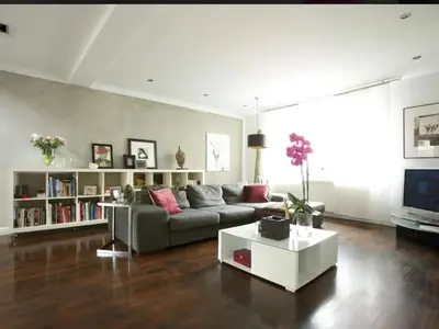 a living room with a couch and a tv at Central London stylish 2-Bed House, with 2 terraces in Moffat