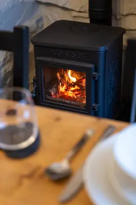 a stove sitting on top of a wooden table at Tegfryn in Moffat
