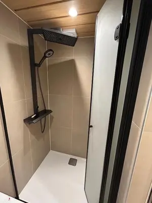 a shower stall in a bathroom with a shower at Baoyan Kingstong - 2 bedrooms in Moffat