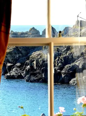 a view of the ocean from a window at Crown hotel in Portpatrick