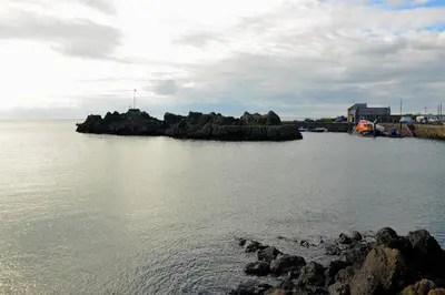 a small island in the middle of a body of water at Crown hotel in Portpatrick