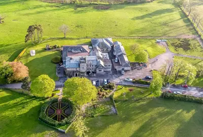 an aerial view of a large house in a field at Hundith Hill Hotel in Cockermouth