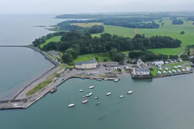 an aerial view of a harbor with boats in the water at Cladach in Garlieston
