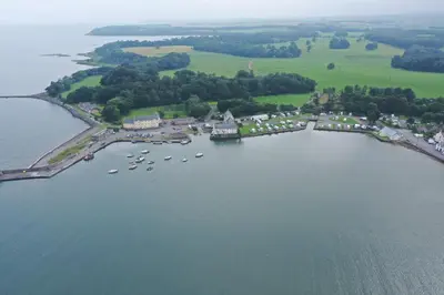 an aerial view of a harbor with boats in the water at Cladach in Garlieston