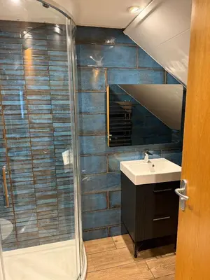 a bathroom with a shower and a sink at The Ship Inn - Winner Best Hotel Experience 2024 Visit Scotland in Gatehouse of Fleet