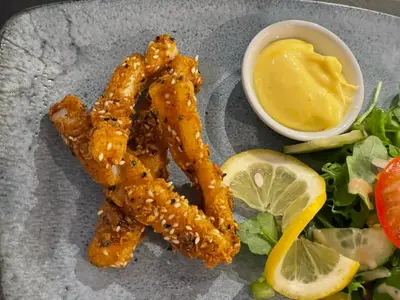 a plate of food with fish sticks and a salad at The Ship Inn - Winner Best Hotel Experience 2024 Visit Scotland in Gatehouse of Fleet