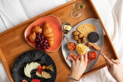 a tray of food with two plates of food at Carlton Hotel in Prestwick