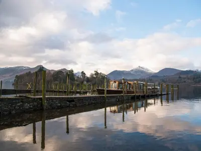 a dock with a bunch of houses on the water at Chaucers Nook in Keswick
