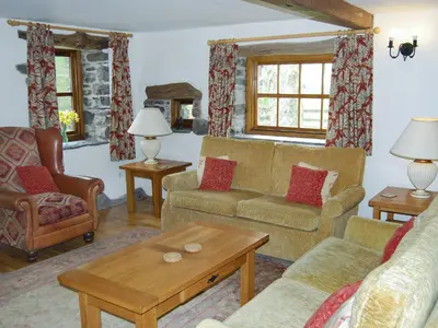 a living room with two couches and a coffee table at The Garth in Mungrisdale