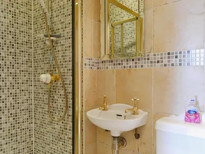 a bathroom with a sink and a shower at Oak Lea in Keswick