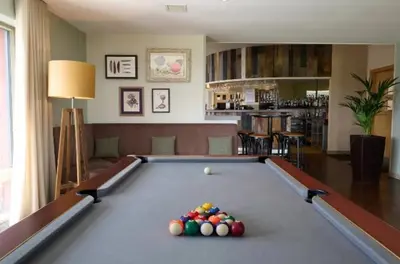 a pool table with balls on it in a living room at Fell View in Troutbeck