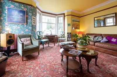 a living room with a couch and a table at The Mount B&B in Keswick