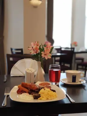 a plate of breakfast food on a table at Mannin Hotel in Douglas