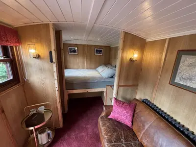 a small room with a couch and a bed at Moffat Independent Hostel in Moffat