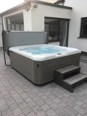a large hot tub sitting outside of a building at Ancrum House in Gretna Green