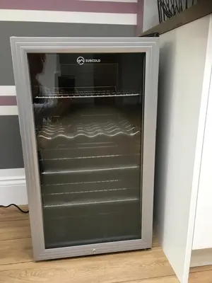 a microwave oven sitting on top of a refrigerator at Ancrum House in Gretna Green