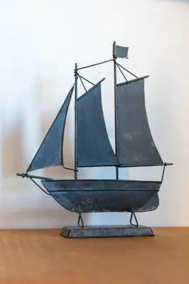 a wooden model of a boat on a table at The Original Donnini Apartment in Ayr