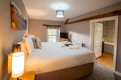 a bedroom with a large white bed and a window at Royal Hotel in Dockray