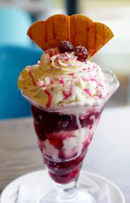 a dessert in a glass cup on a plate at The Gailes Hotel & Spa in Irvine