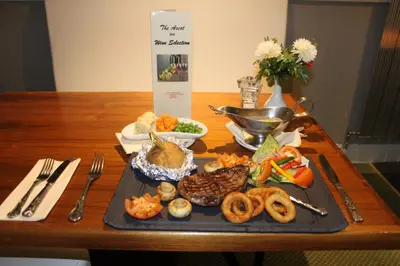 a table with a tray of food on a table at Ascot Hotel in Douglas