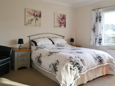 a bedroom with a bed and a window at Crossfeld in Keswick