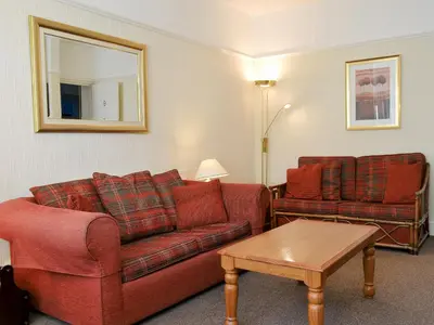 a living room with a couch and a table at Skiddaw in Keswick