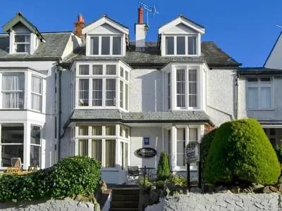 a large white house with white windows at Blencathra in Keswick