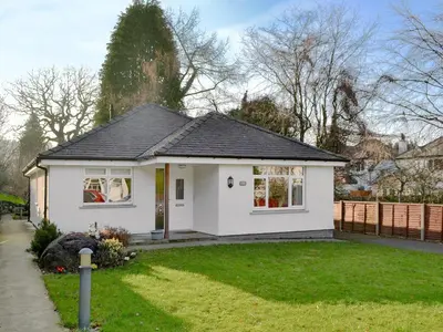 a white home with a black roof at Cobble Garth in Keswick