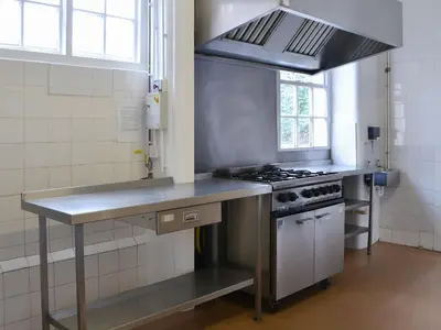a kitchen with a stove and a counter top at Blaithwaite House in Blencogo