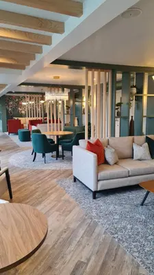a living room with a couch and a table at Smiths At Gretna Green Hotel in Gretna Green