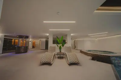 a lobby with chairs and a table in a building at Cairndale Hotel & Spa in Dumfries