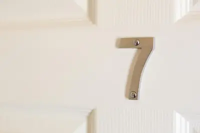 a number on a wall in a room at Wordsworth Apartment Irene court in Cockermouth