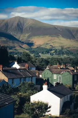 a small town with houses and mountains in the background at The Coledale Inn in Keswick