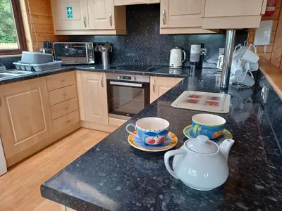 a kitchen with two tea cups on a counter at Green View Lodges in Wigton