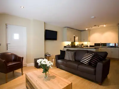 a living room with a couch and a table at Carrigbaun in Braithwaite