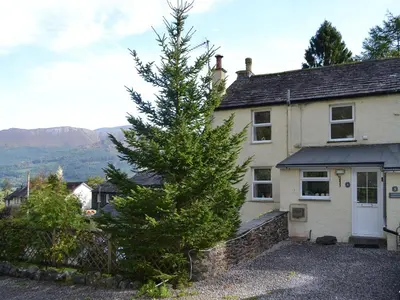 a christmas tree in front of a house at Fairholme in Braithwaite