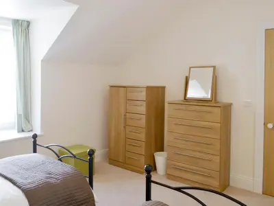 a bedroom with a dresser and a mirror on a dresser at Fairview in Rockcliffe