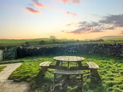 a picnic table in the middle of a field at Culquhasen in Gillespie