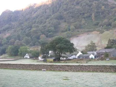 a small village with a mountain in the background at The Langstrath Country Inn in Keswick