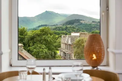 a window with a view of a mountain view at Balmoral Apartment in Keswick