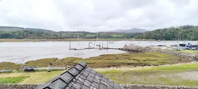 a view of a body of water with a boat dock at The Mariner Hotel in Kippford